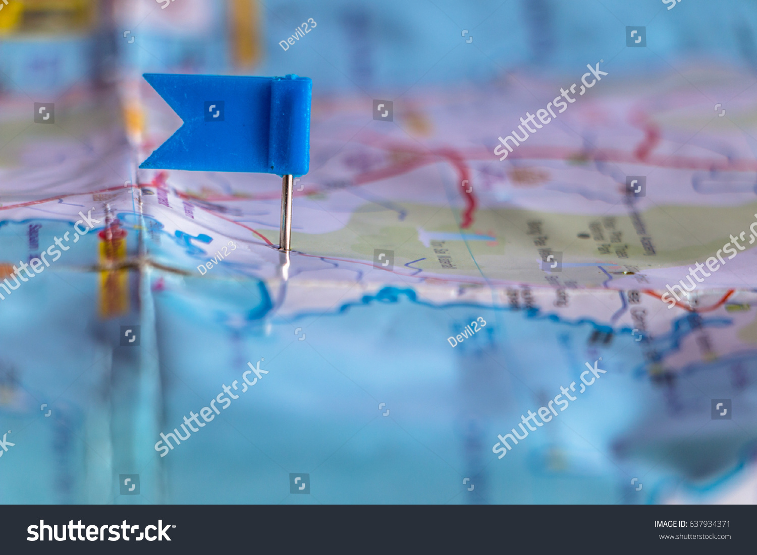 Travel destination pin points on a map with colorful thumbtacks and depth of field with select focus. #637934371