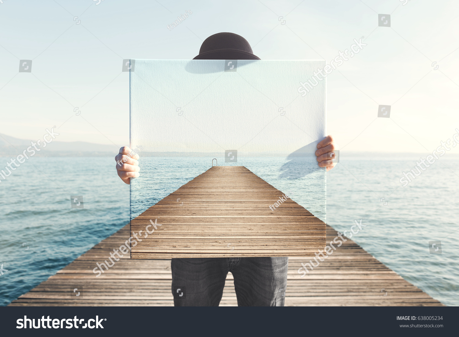 Man holding surreal painting of a boardwalk #638005234