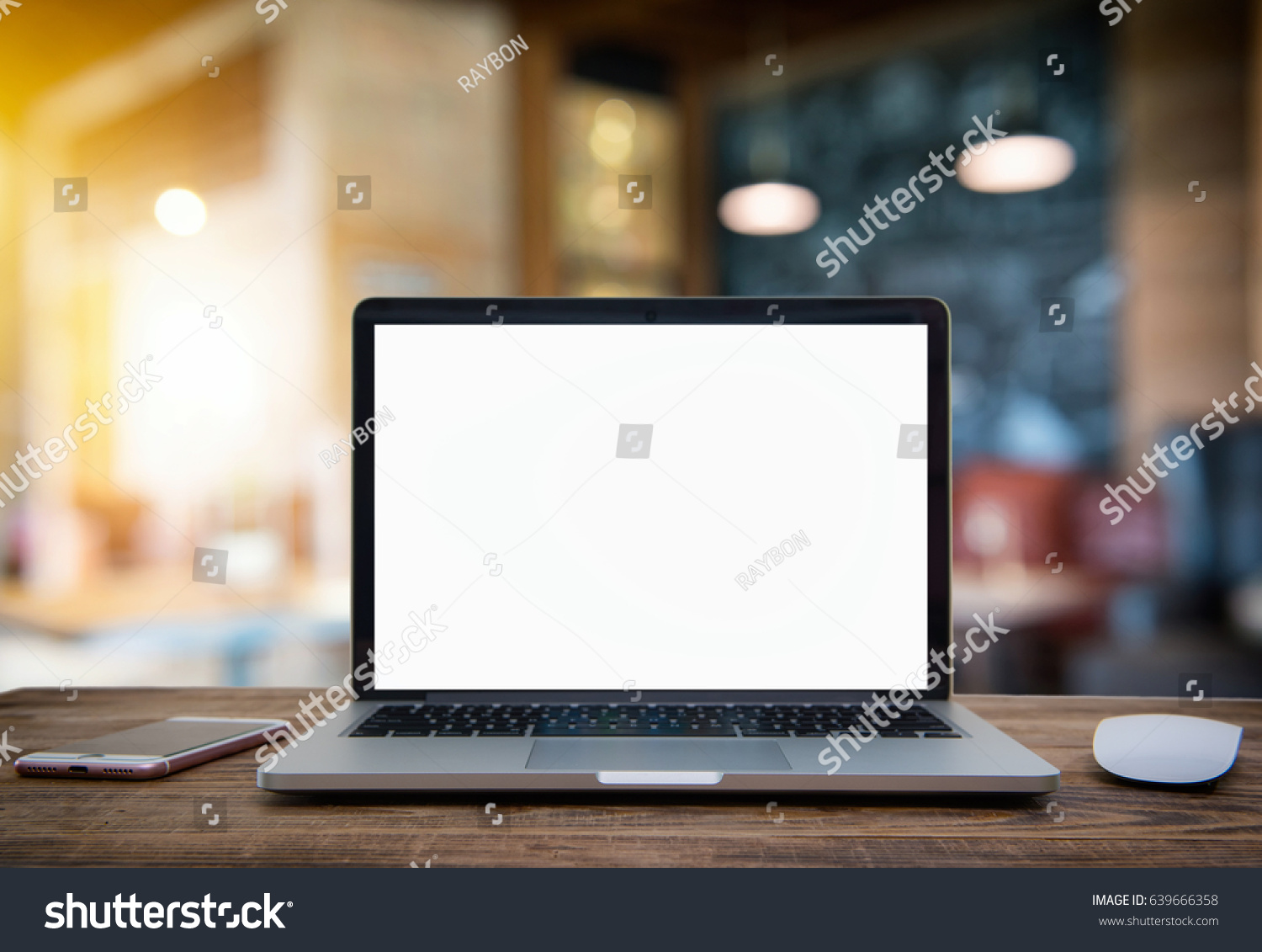 Computer Laptop with blank screen on  table of coffee shop blur background with bokeh, desk  blank work office mockup monitor #639666358