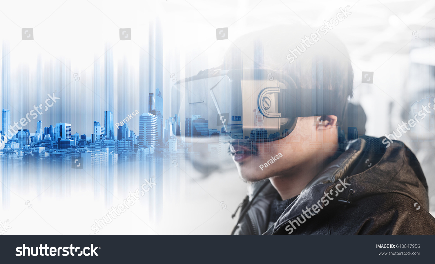 Businessman wearing virtual reality googles, with double exposure modern buildings technology #640847956