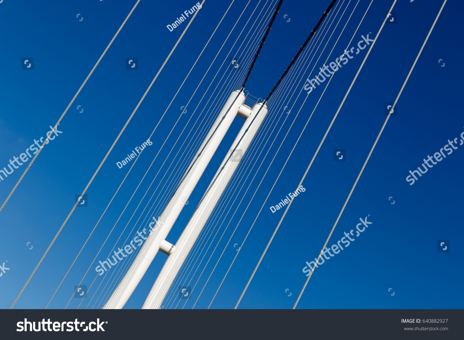 Suspension bridge on blue sky background #640882927