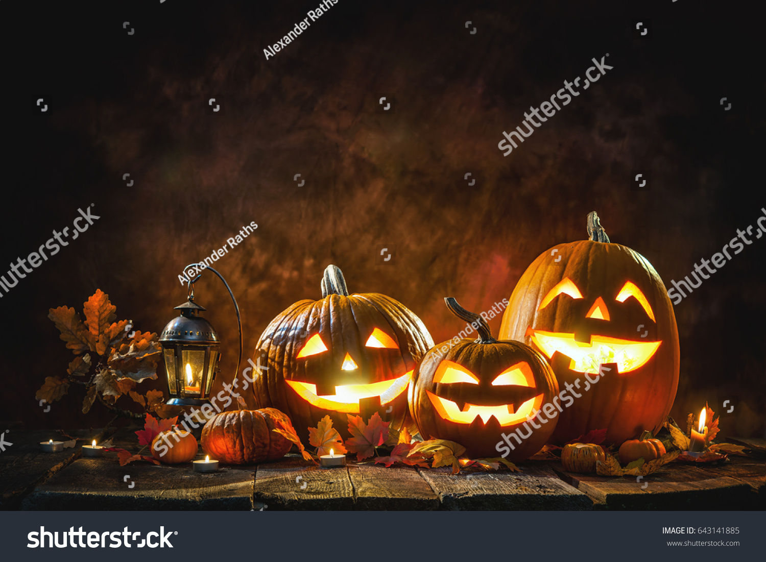 Halloween pumpkin head jack lantern with burning candles #643141885