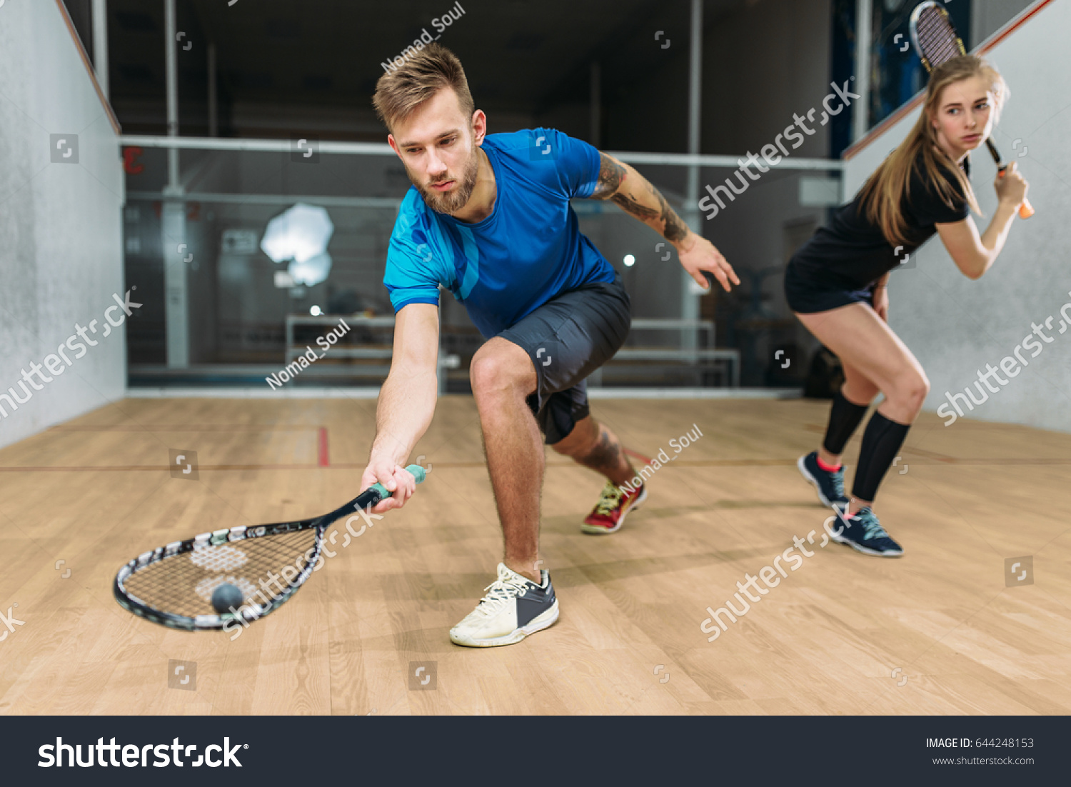 Squash game training, players with rackets #644248153