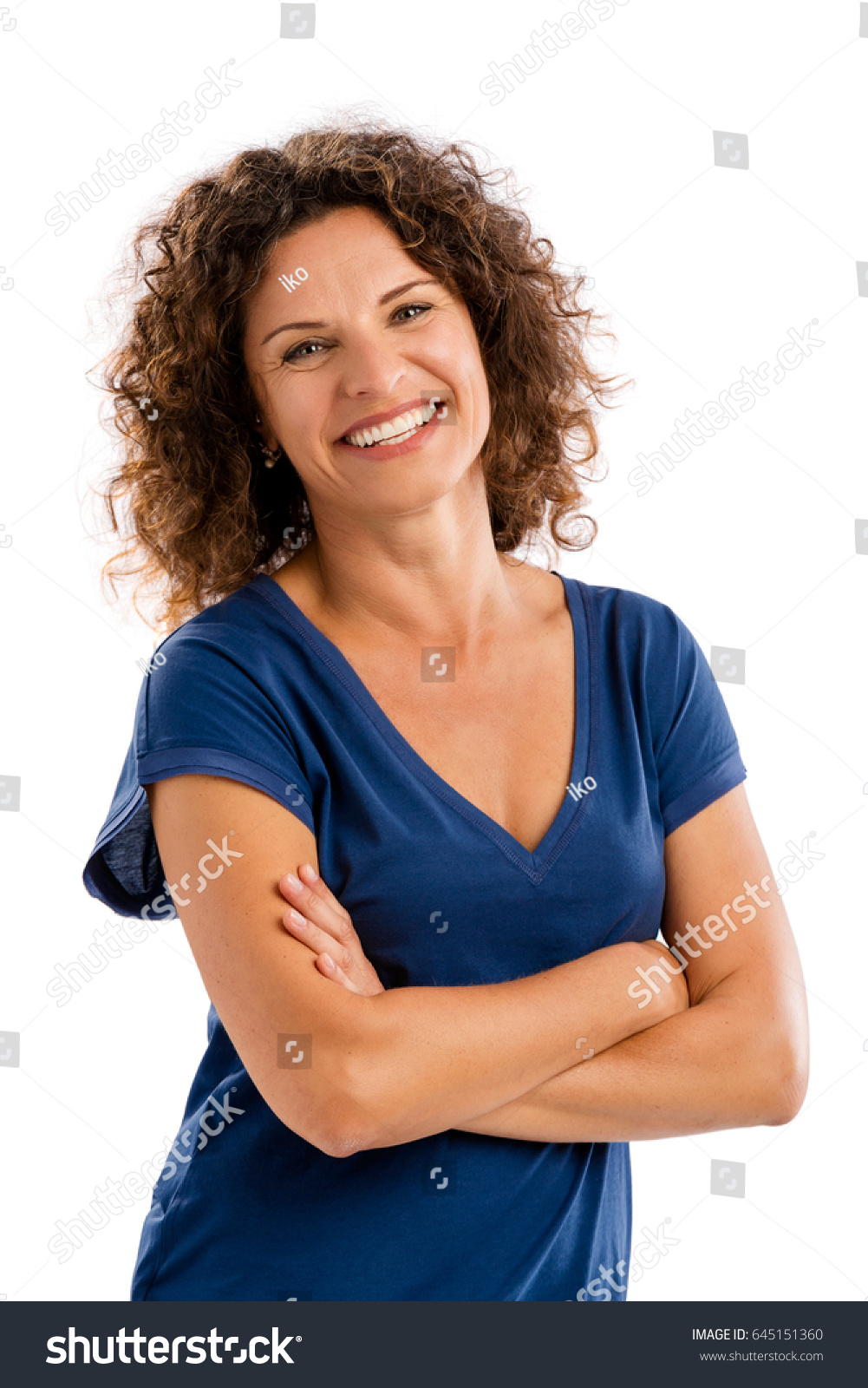 Smiling middle aged woman with arms folded, isolated on white background #645151360