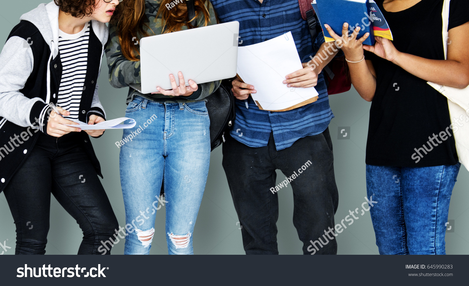 Group of Diverse High School Students Using Digital Devices Studio Portrait #645990283