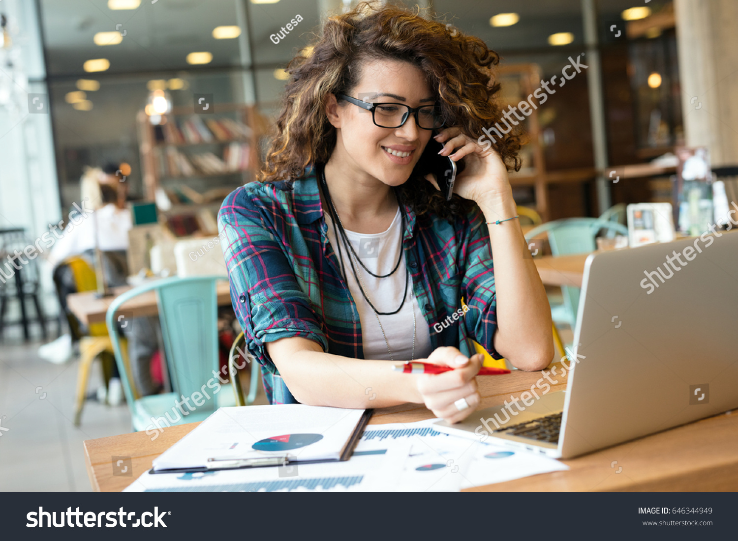 Modern business woman in city cafe. Surfing the web. #646344949