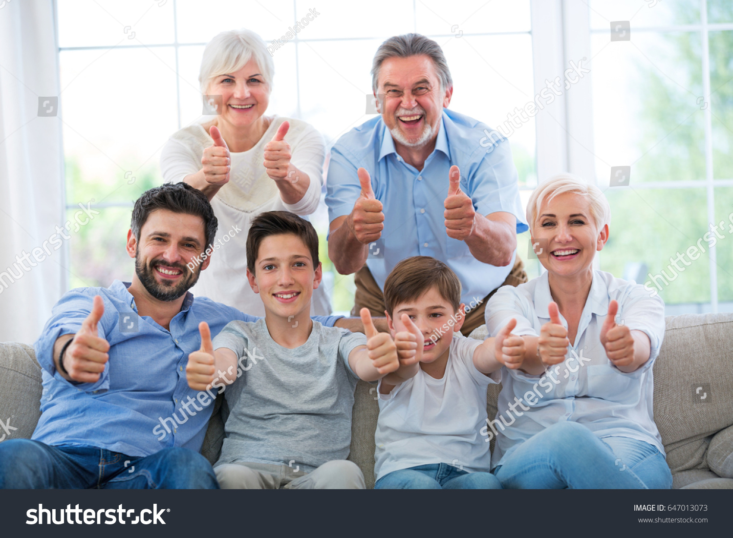 Family showing thumbs up #647013073
