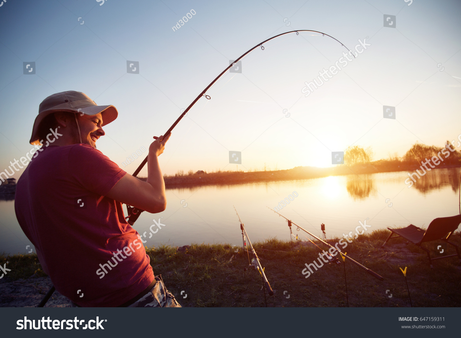Fishing as recreation and sports displayed by fisherman at lake #647159311