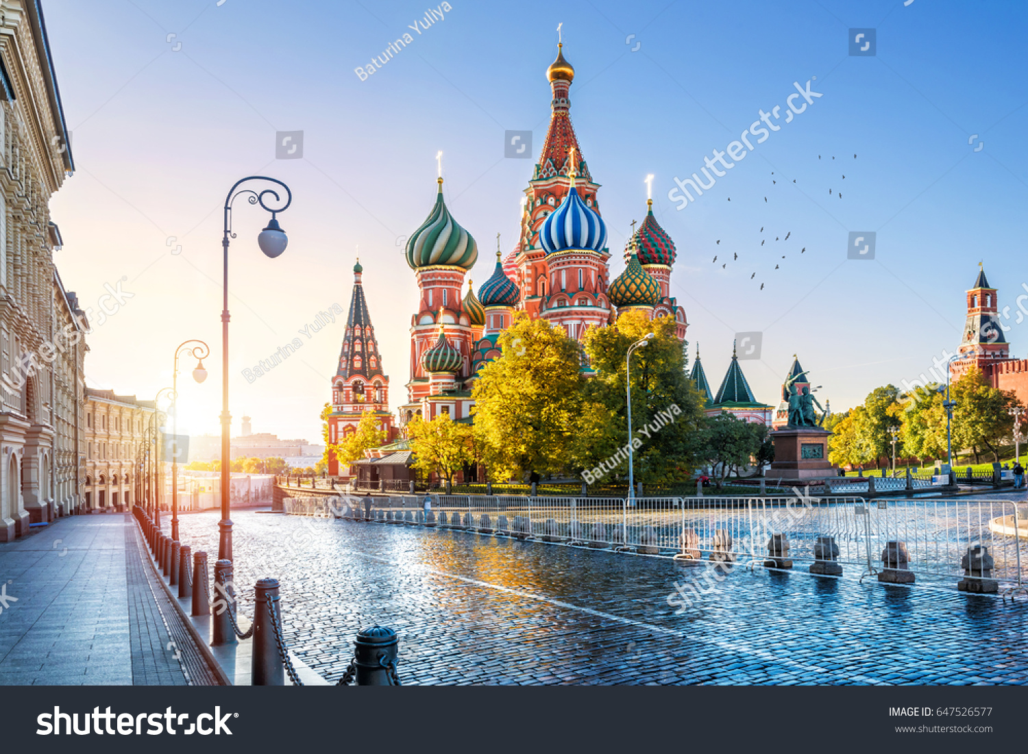 St. Basil's Cathedral on Red Square in Moscow and the morning autumn sun #647526577