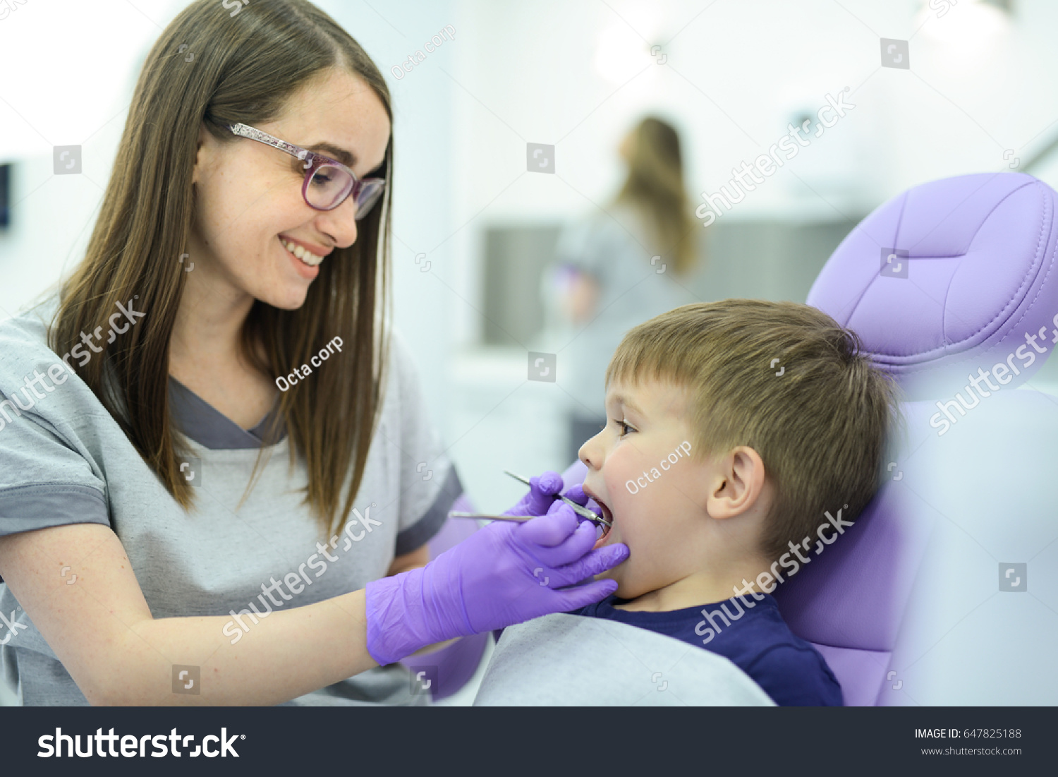 A little boys first check up. Kid visits the dentists office for the first time  #647825188