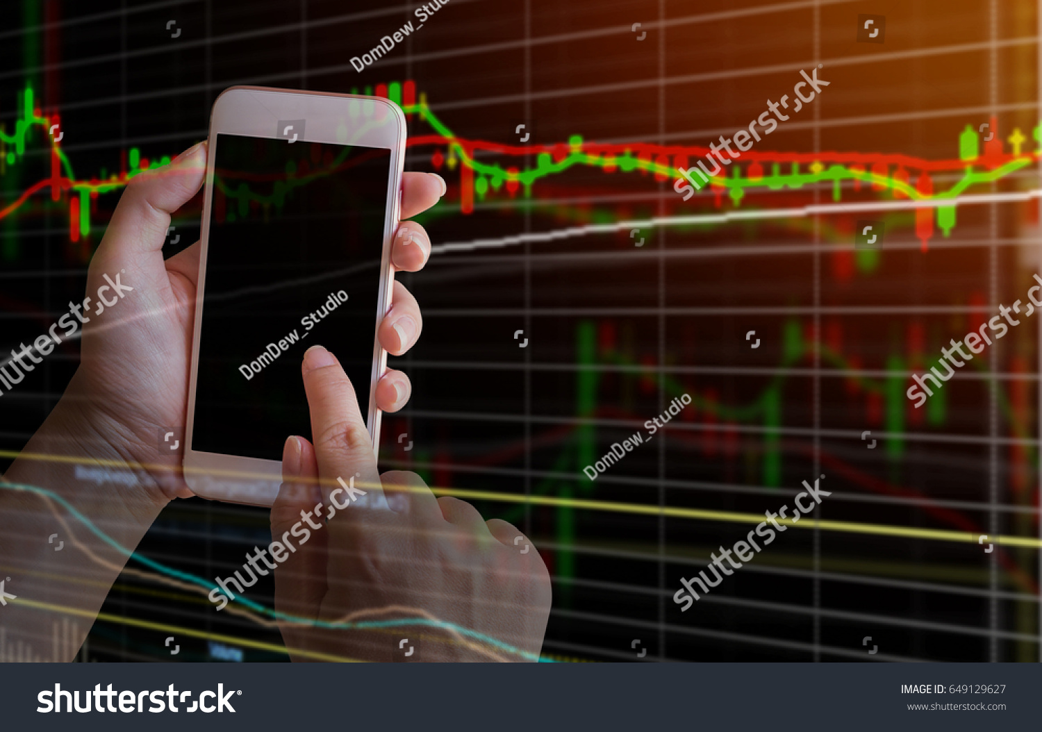 Double exposure smartphone on hand with stock market graph on screen background. with filtered red color abstract background to forex and stock concept. #649129627