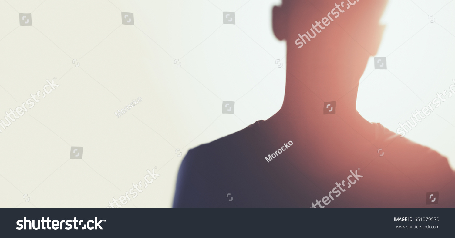 silhouette of unknown man with sun flares #651079570