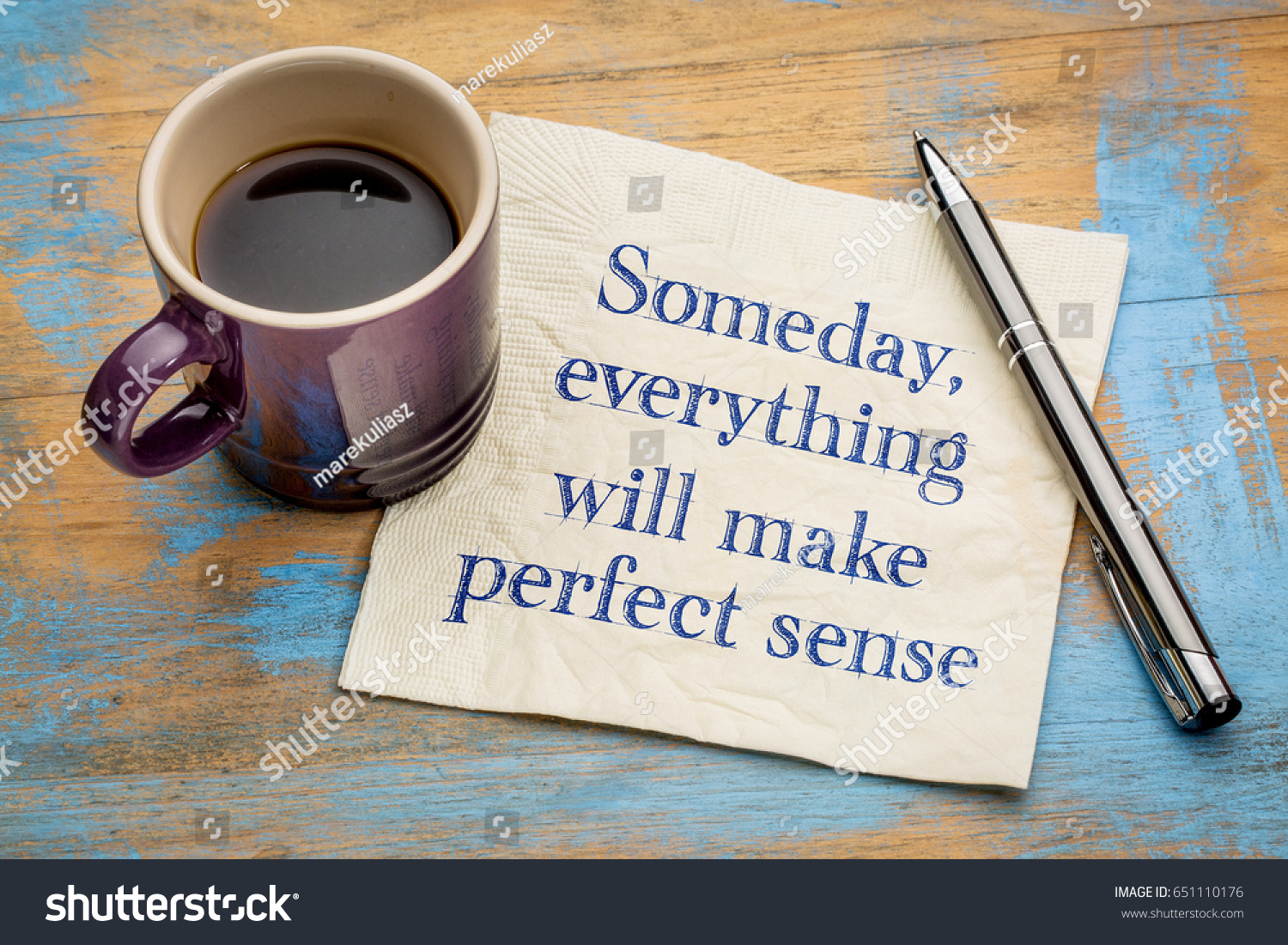 Someday, everything will make perfect sense - handwriting on a napkin with a cup of espresso coffee #651110176