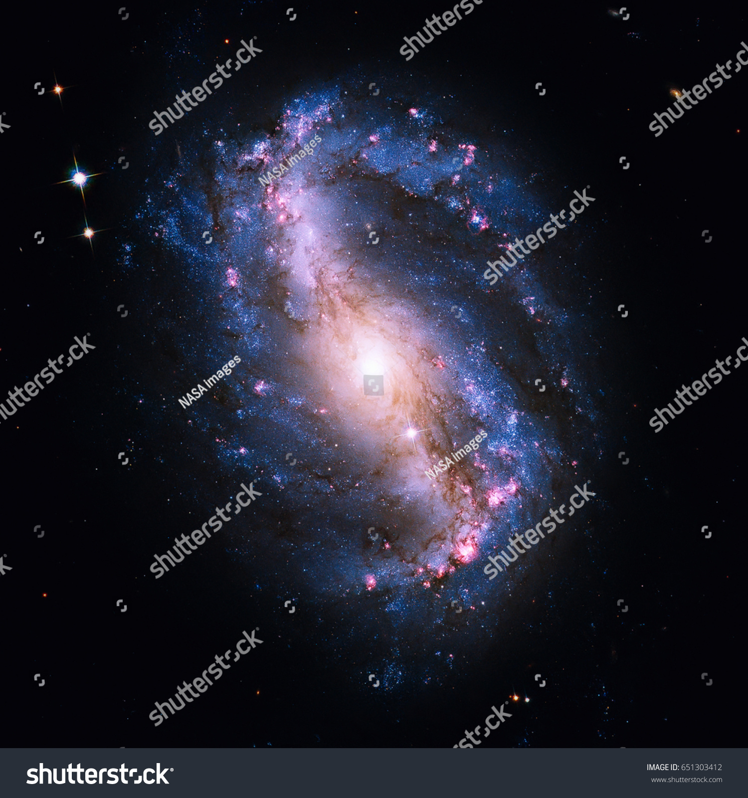 NGC 6217 is a barred spiral galaxy located some 67 million light years away, in the constellation Ursa Minor. Retouched image. Elements of this image furnished by NASA. #651303412