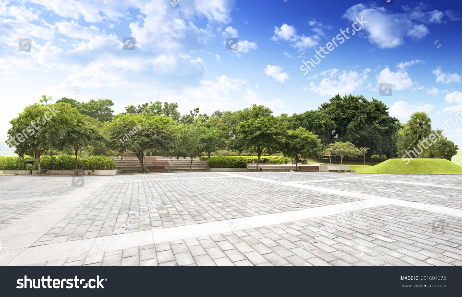 Empty street at the nice and comfortable garden background with nice blue sky #651604672