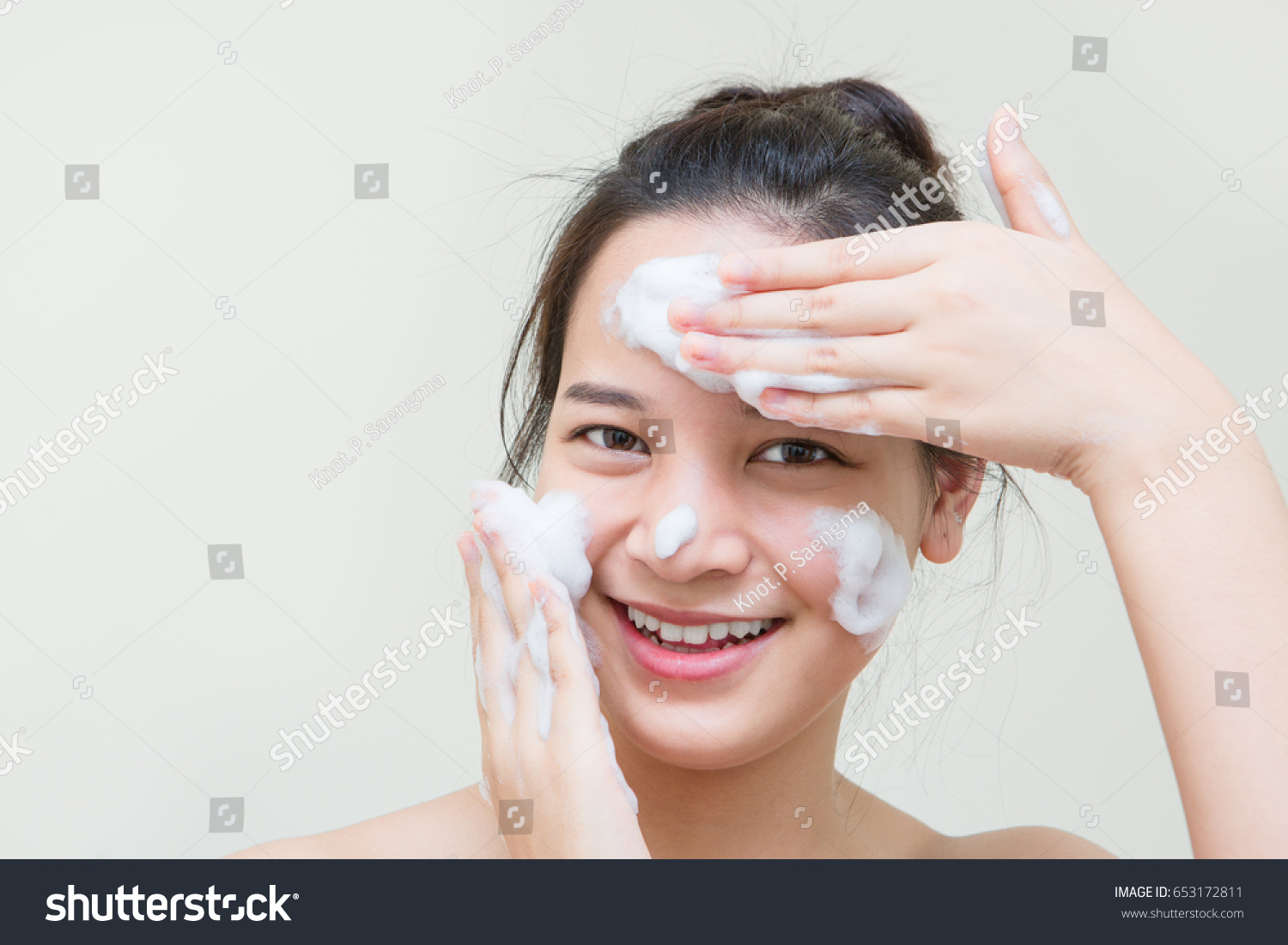 cute teenager Asian girl with baby face skin enjoy herself with bubble cleansing foam  #653172811