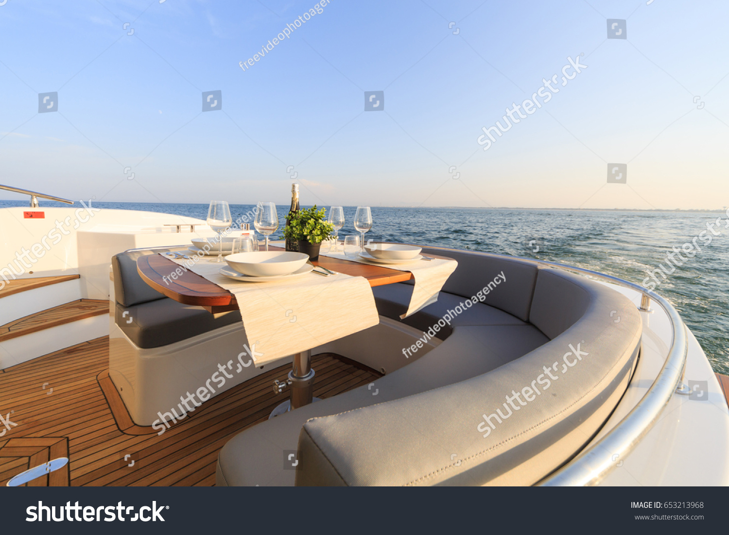 romantic lunch on motor yacht at sunset, Table setting at a luxury yacht. #653213968