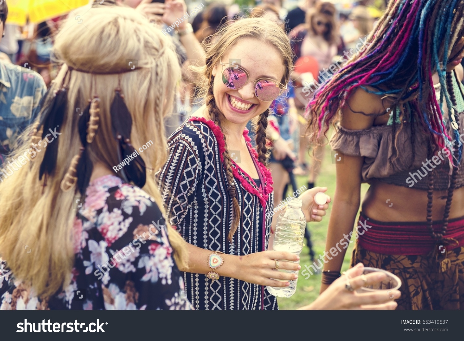 Group of Friends Drinking Beers Enjoying Music Festival together #653419537