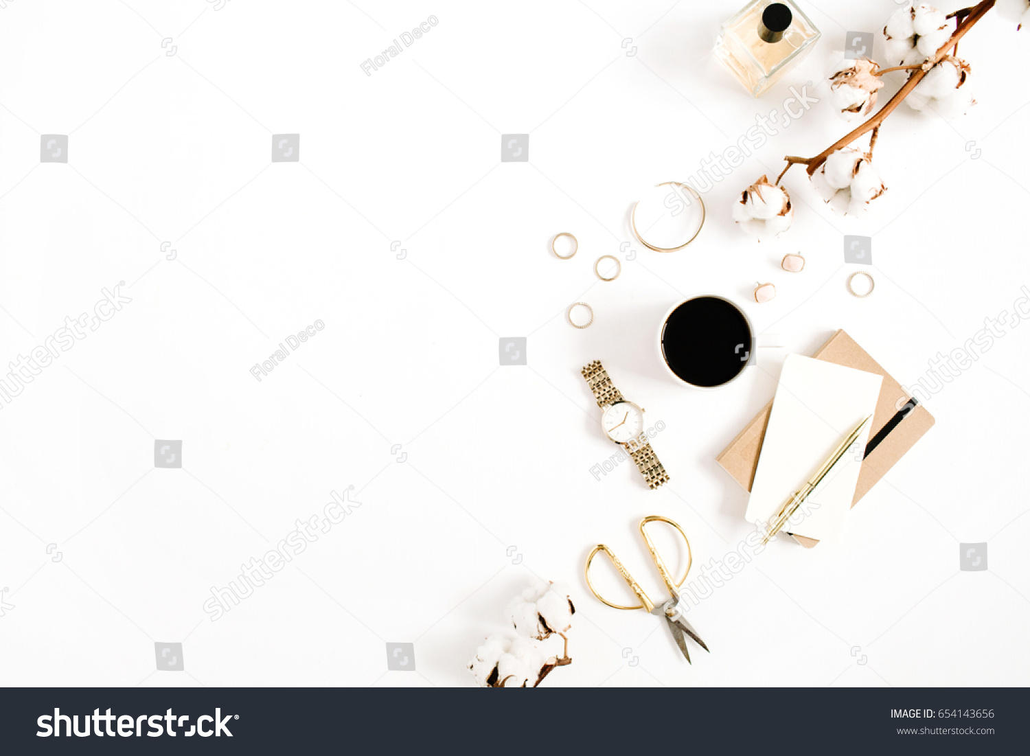 Fashion blog gold style desk with woman accessory collection: golden watches, scissors, coffee cup, notebook and cotton branch on white background. Flat lay. Top view. #654143656
