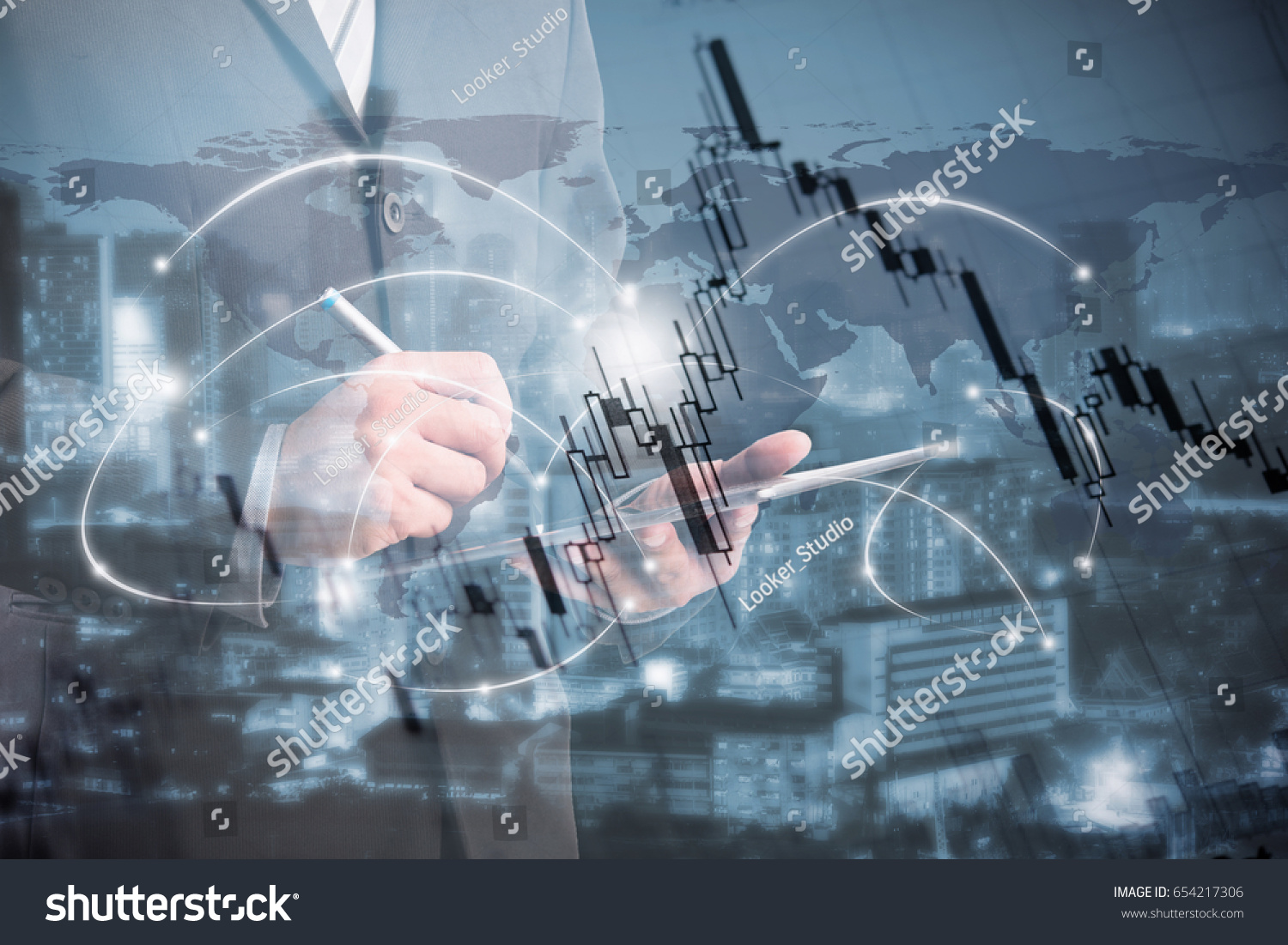 double exposure of businessman using tablet with blur city night and stockgraph. #654217306