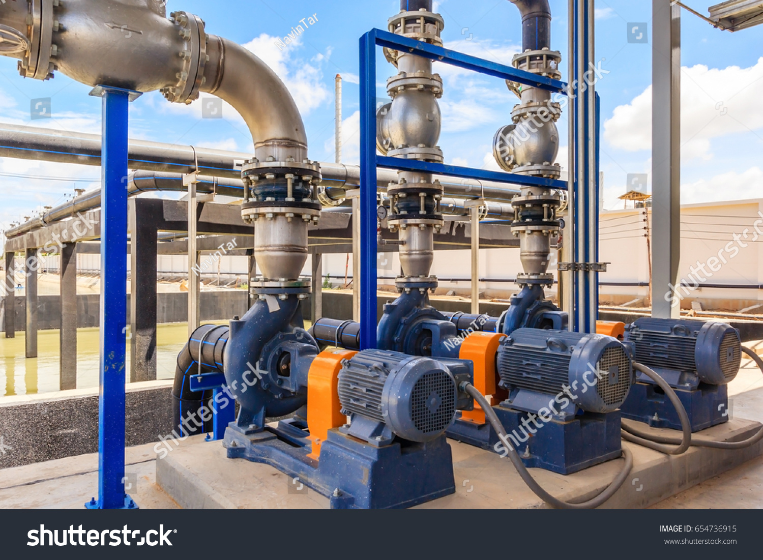 Wastewater treatment plant. A new pumping station. Valves and pipes. Urban modern treatment facilities, pipelines and pumps powerful, modern automatic system protection and control. #654736915
