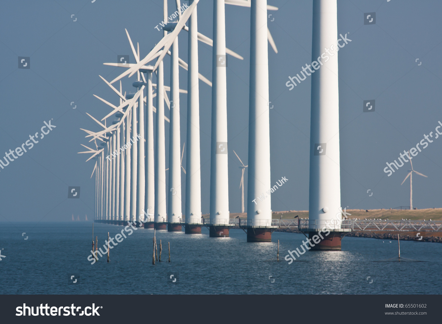 Big windturbines along the Dutch coast #65501602