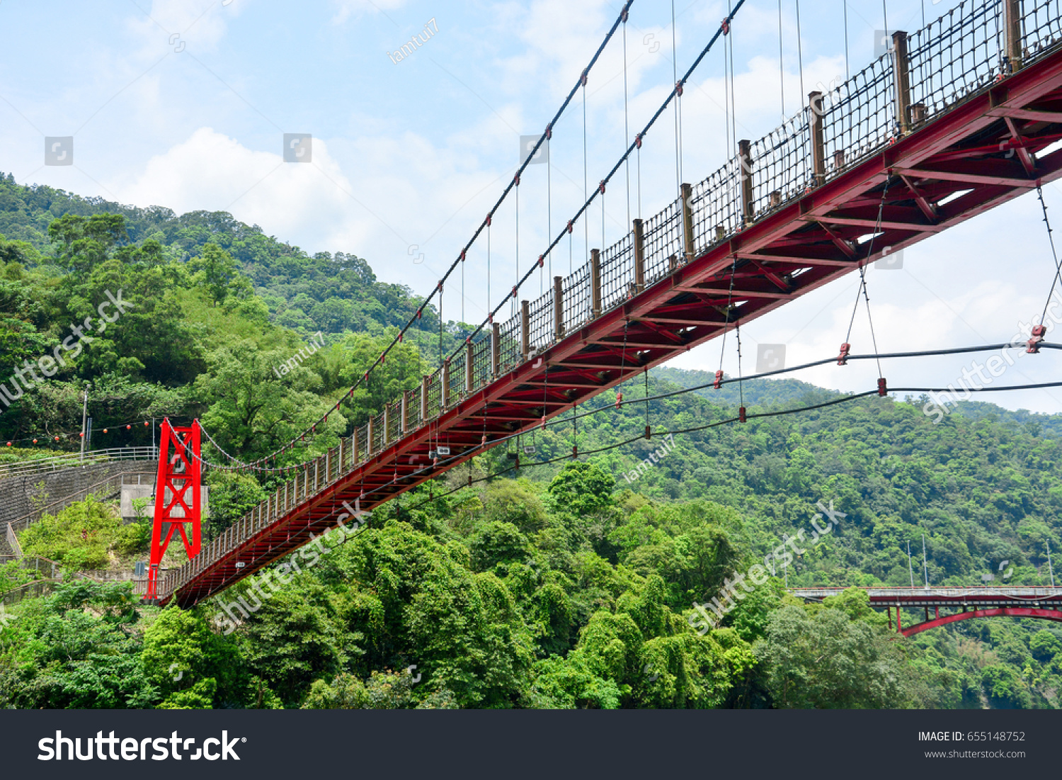 red hanging bridge or suspension bridge in the valley, Wulai, Taiwan #655148752