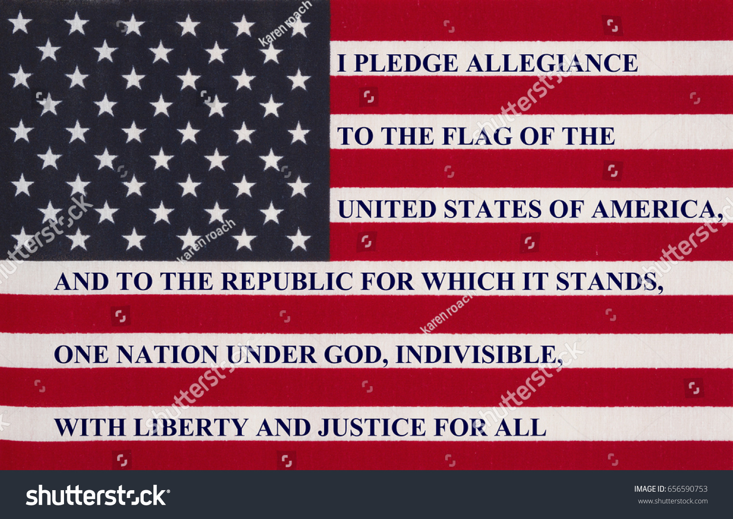 The pledge of allegiance written on the United States of America flag #656590753