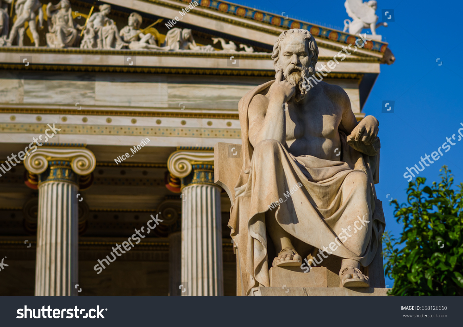 Close-up statue of the Greek philosopher Socrates on the background of classical columns #658126660