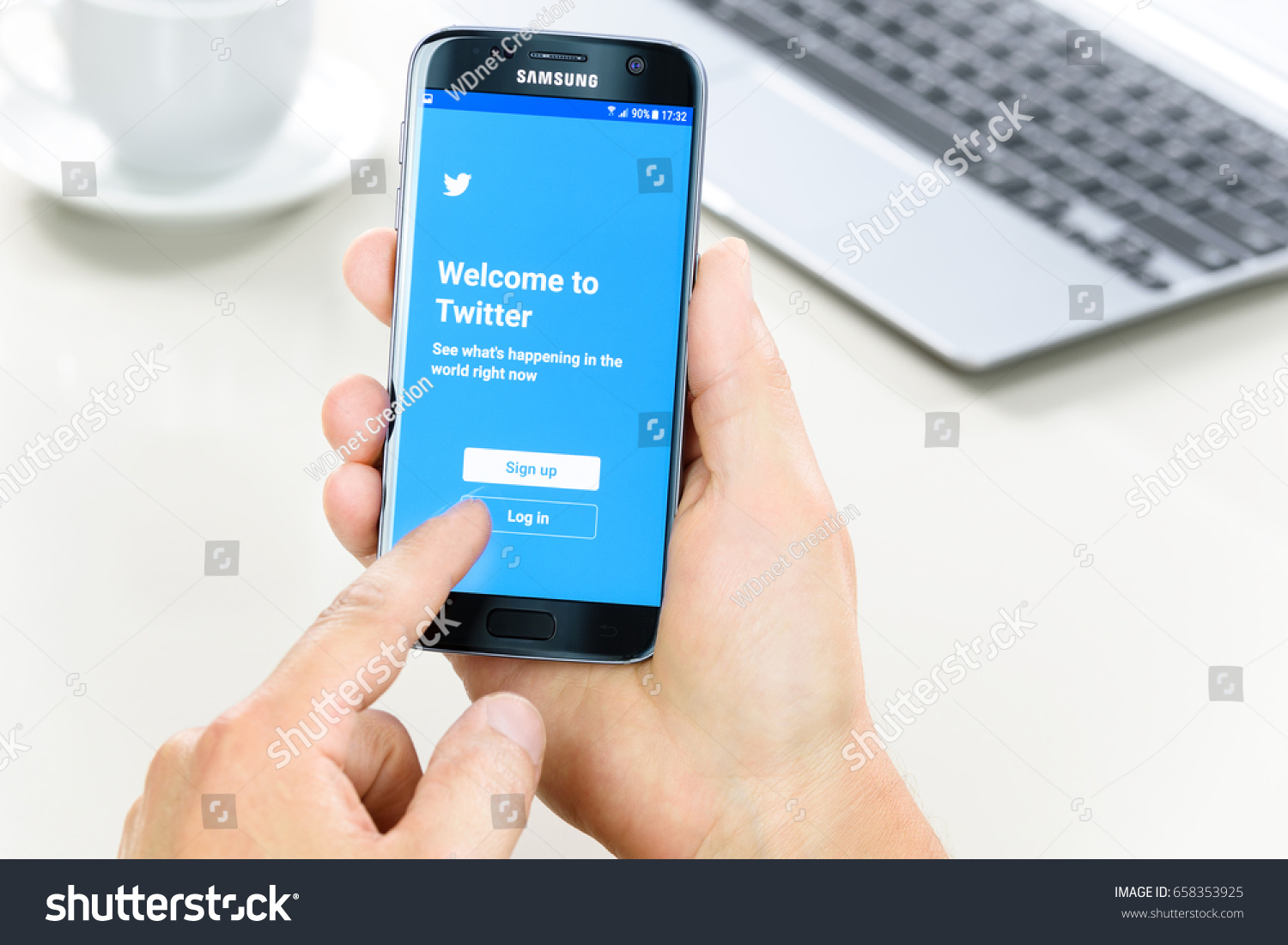 Krynica Poland - June 10, 2017: Samsung Galaxy S7 in the hand when logging into Twitter applications. Twitter is one of the most popular social networking service in the world. #658353925