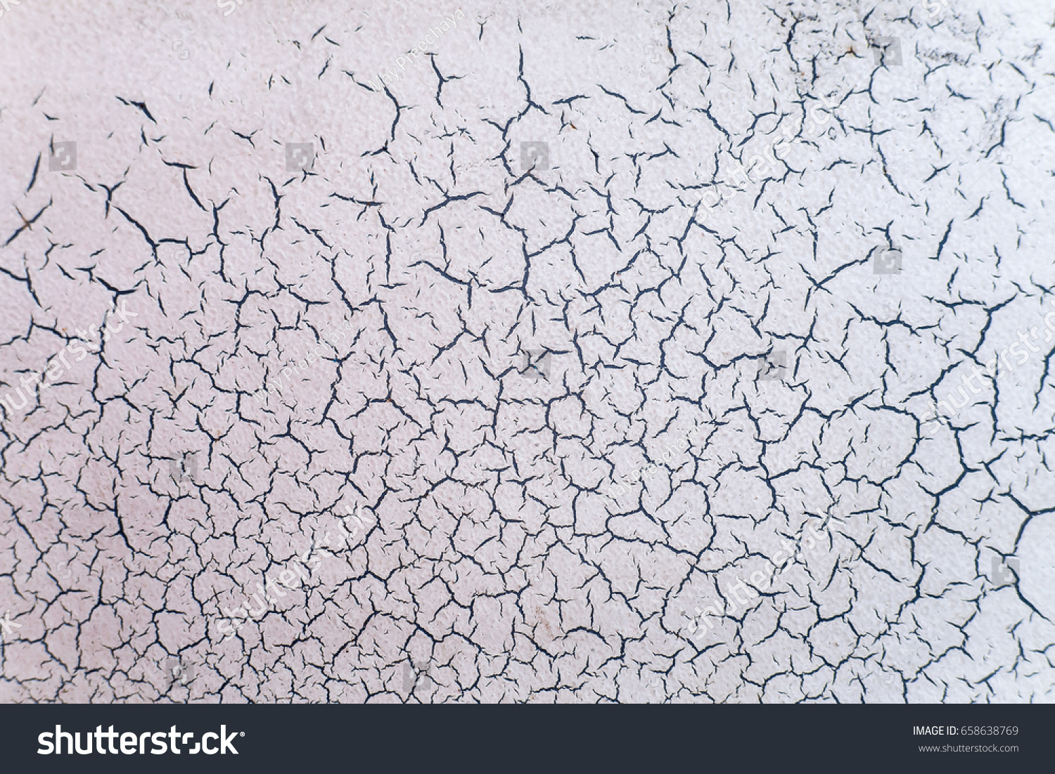 Cracked and peeling paint texture background. Close-up of old dirty white wall cracking.  #658638769