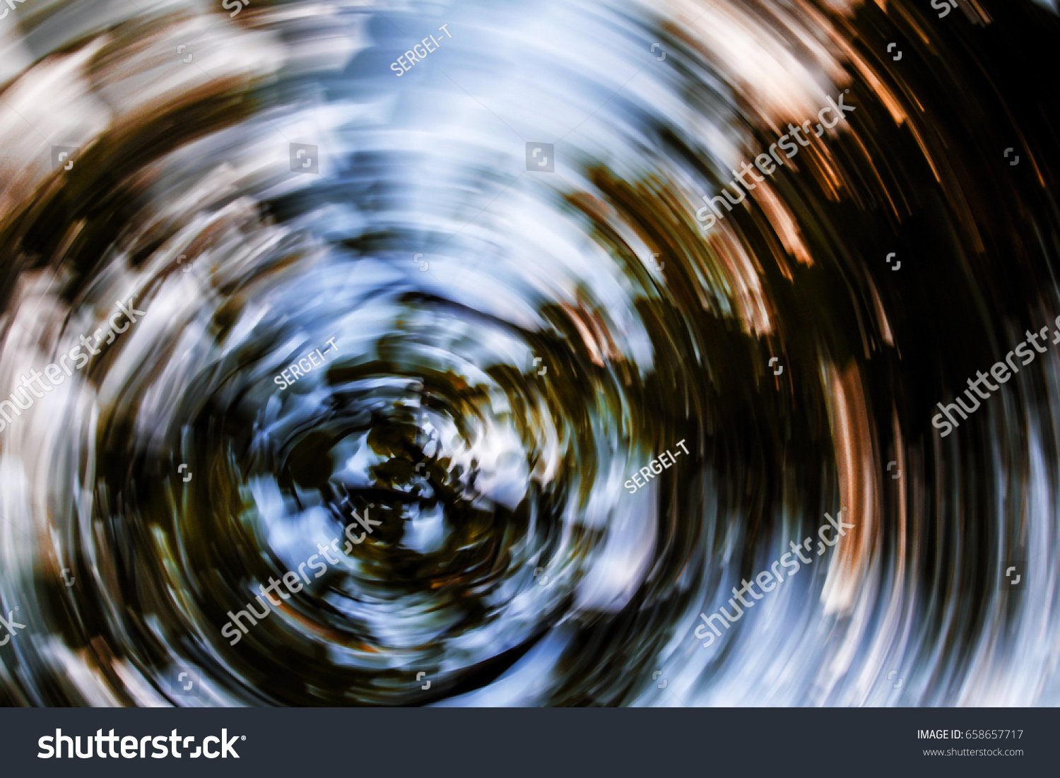 Autumn leaves in radial motion,circular motion,circular rotation of the camera,blur in a circular motion #658657717