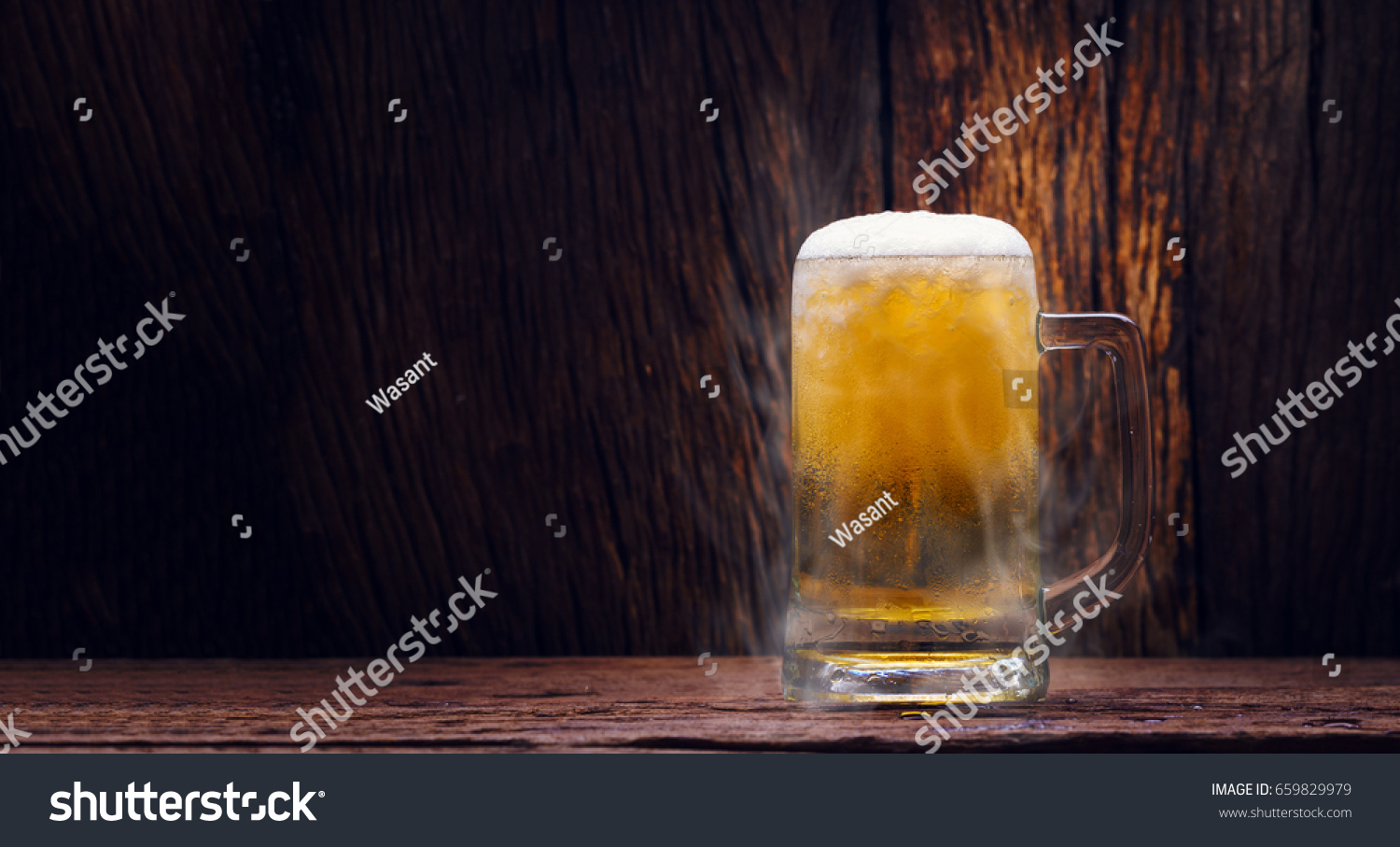 Glass cold beer on wood background with copy space #659829979