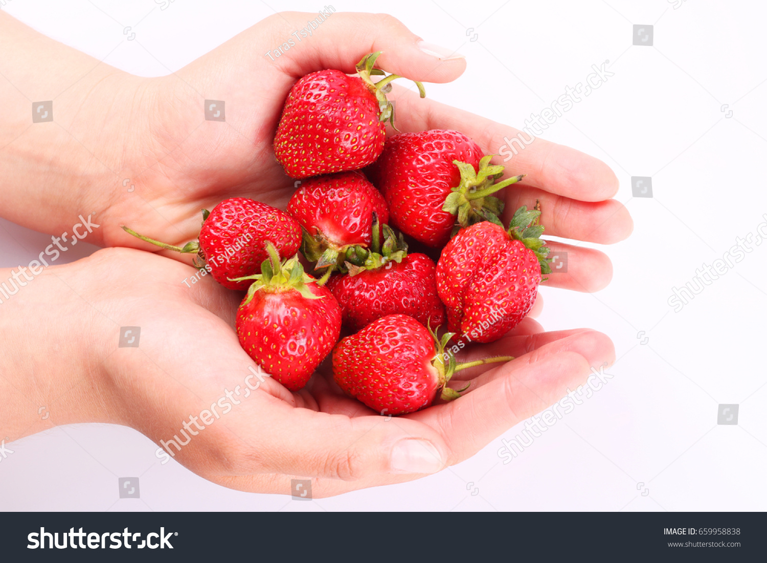 strawberrys in hand #659958838