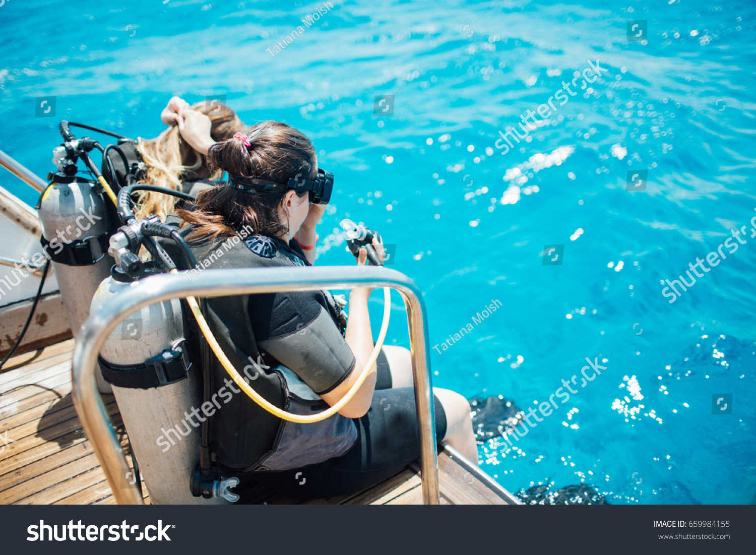 Scuba diver before diving. Diving lesson in open water. #659984155