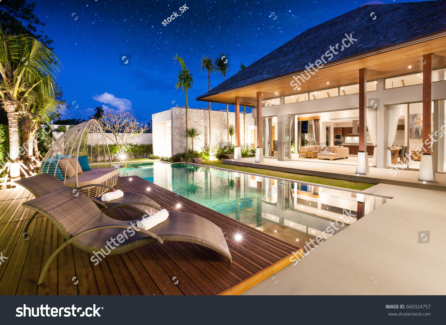 real estate Luxury Interior and exterior design  pool villa with living room  at  night sky  home, house ,sun bed ,sofa #660324757