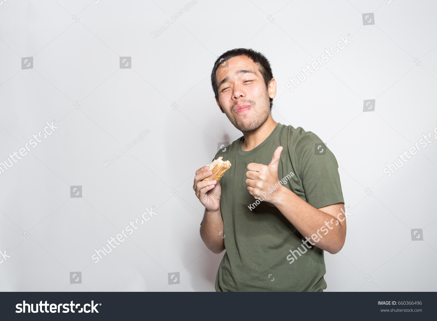 unhealthy eating concept, man enjoy and happy to eat his junk food with delicious face expression #660366496
