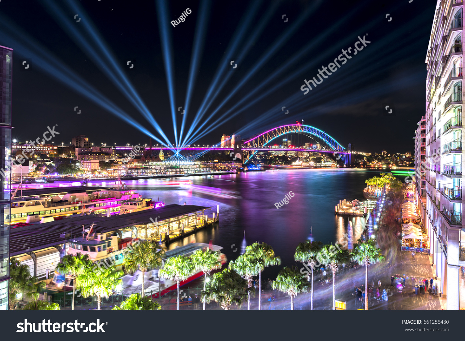 Circular Quay and Sydney Harbour Bridge illuminated with colorful light, during the Vivid Sydney 2017  #661255480