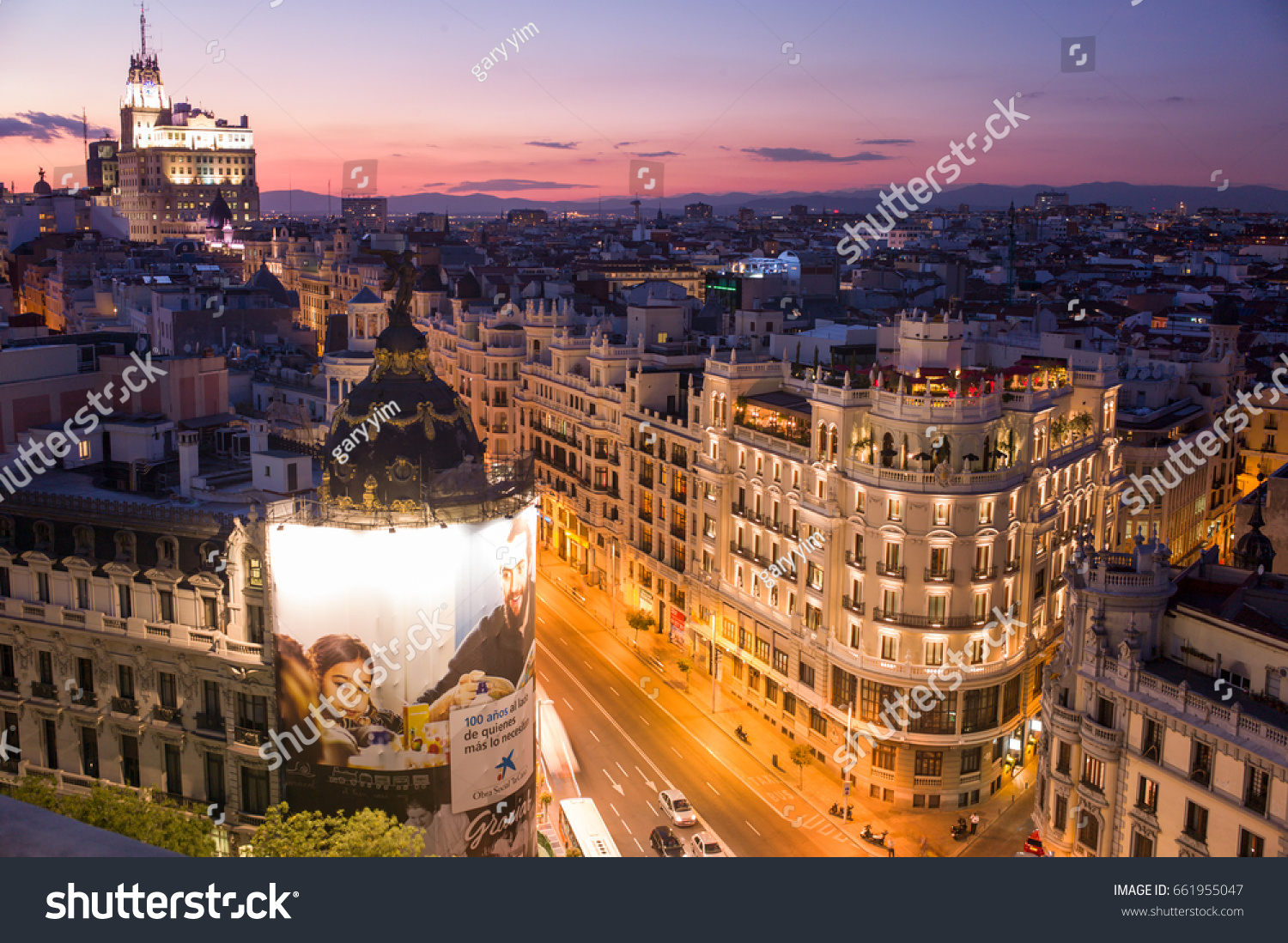 Madrid, Spain - September 29 2015: The sunset view of commercial buildings on Gran Via, where busiest street in the city. #661955047