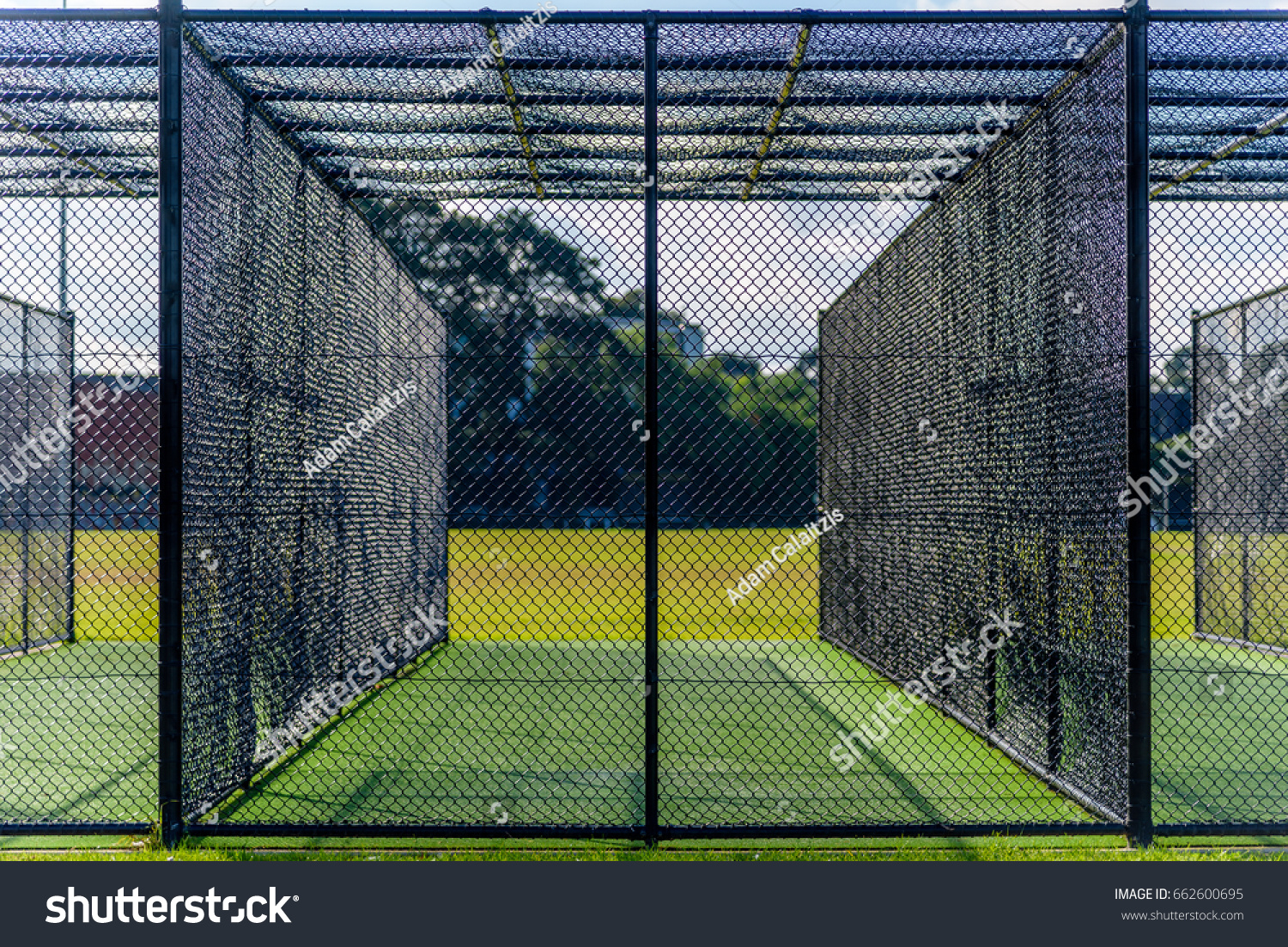 A cricket practice net on green grass in Melbourne, Victoria, Australia #662600695