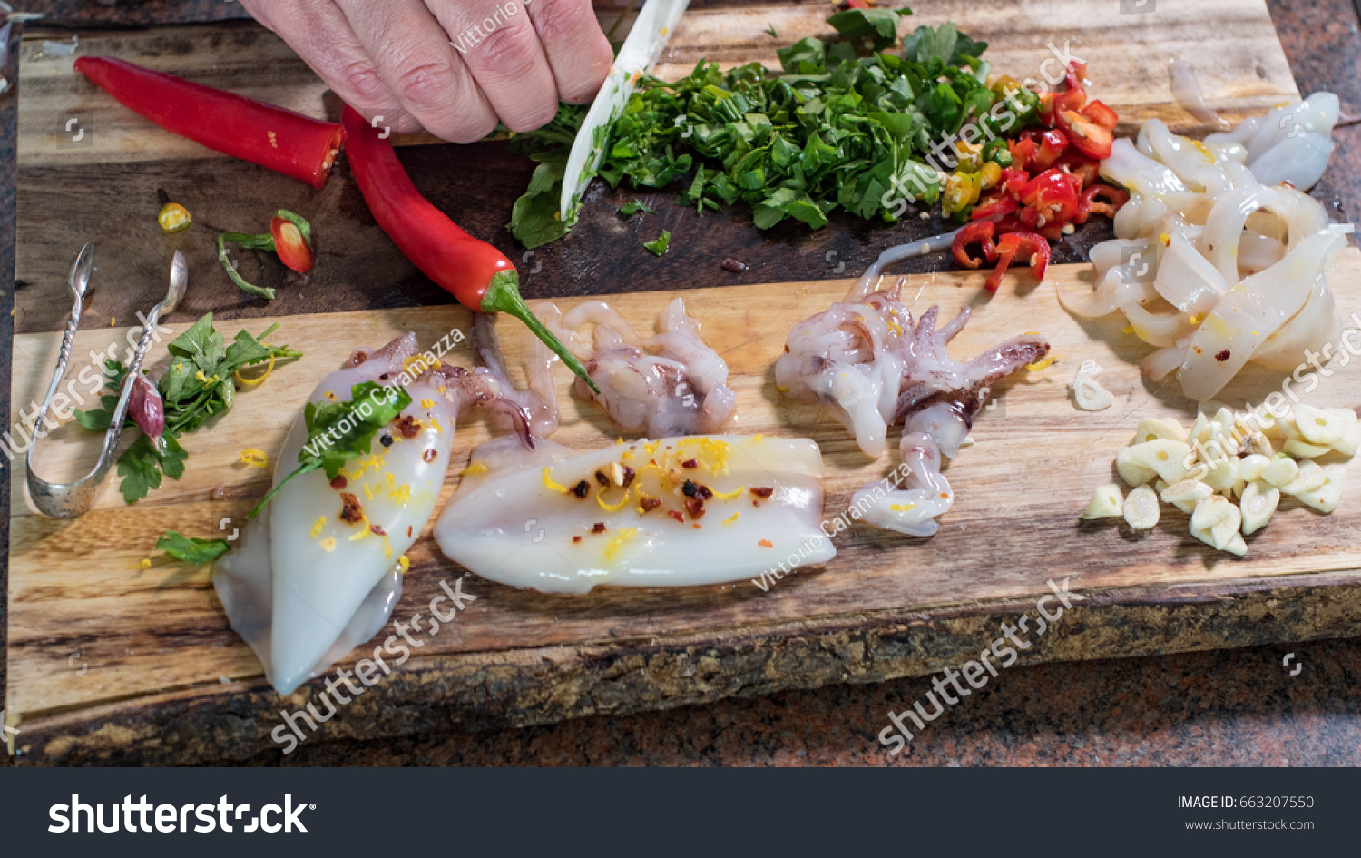 preparing ingredients for black pasta with squids (cuttlefish) and ink: cutting parsley #663207550