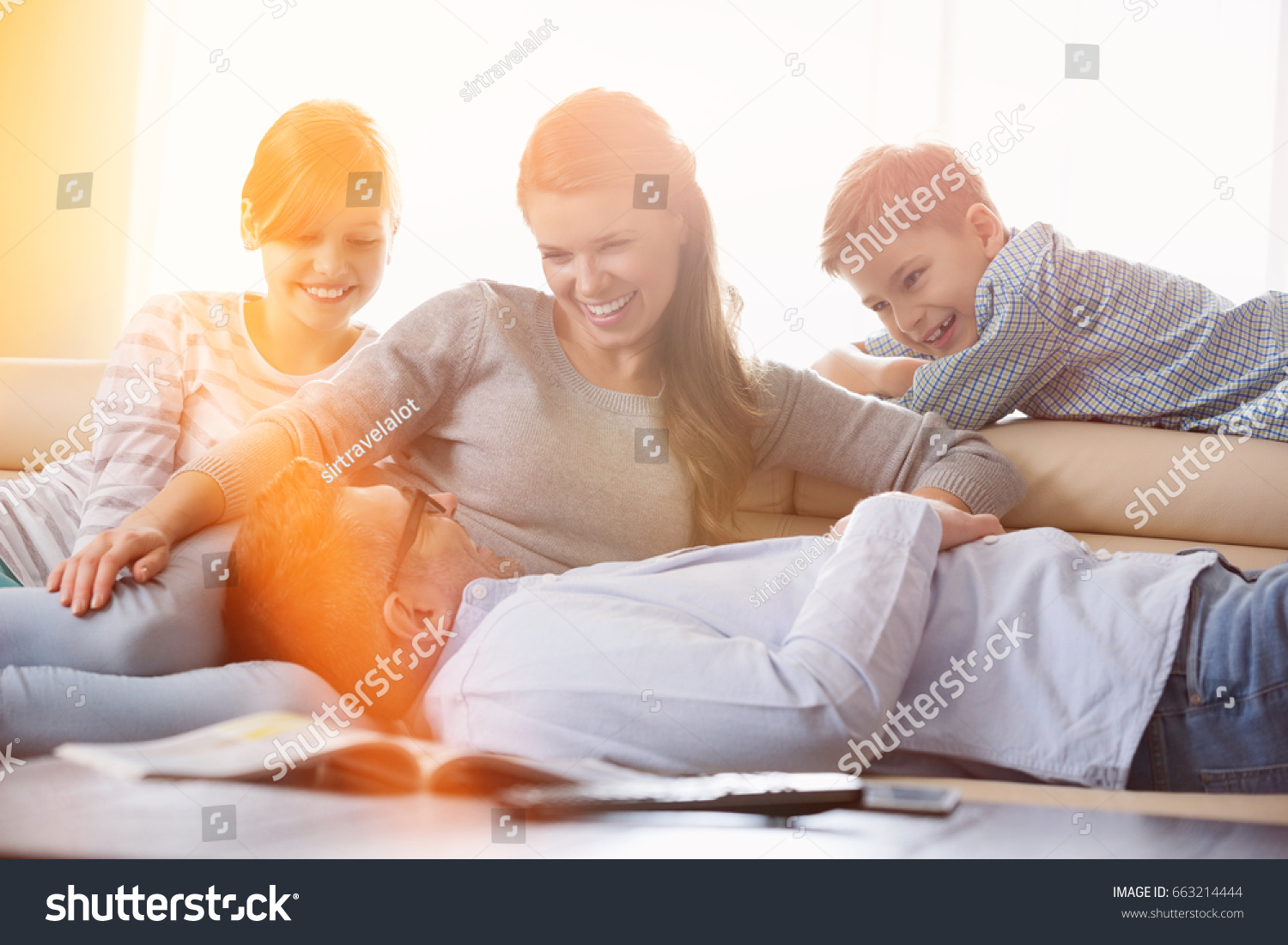 Happy family in living room #663214444