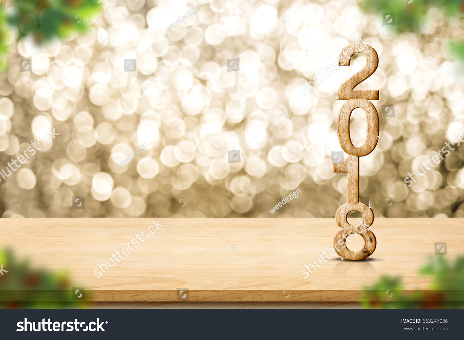 Happy new year 2018 on wood table and blur Christmas tree foreground at blur sparkling gold bokeh light wall,panoramic banner for display or montage of product,holiday seasonal. #663247036