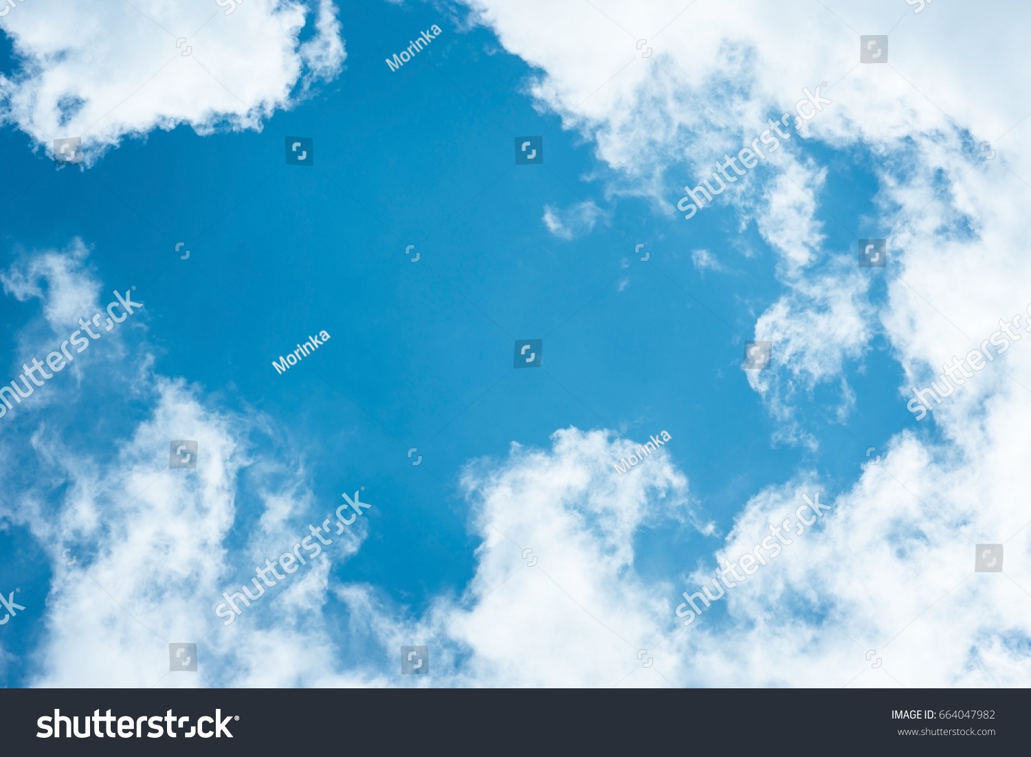 Cumulus humilis clouds in the blue sky, view from below #664047982
