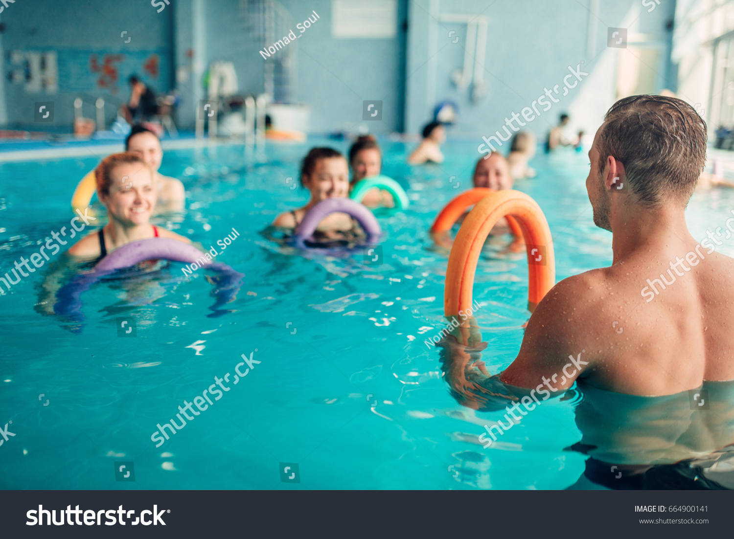 Aqua aerobics, women class with male trainer #664900141