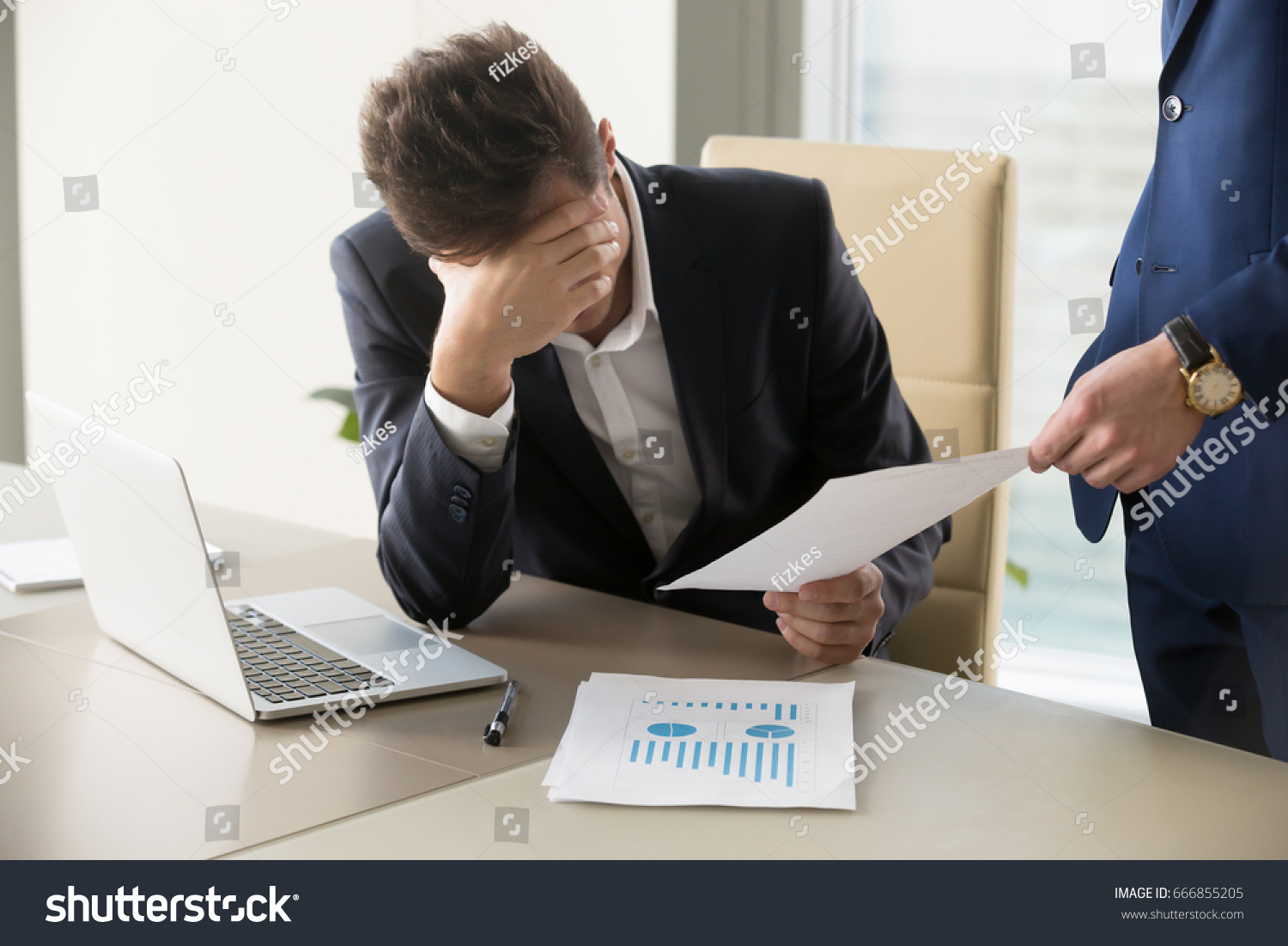 Sad manager getting notice of dismissal, sitting at workplace with laptop and financial documents, employee receiving letter with bad news, entrepreneur upset by commercial failure or firm bankruptcy  #666855205