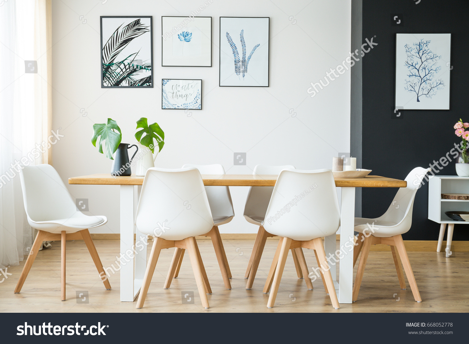 Bright spacious dining room with wooden big table #668052778