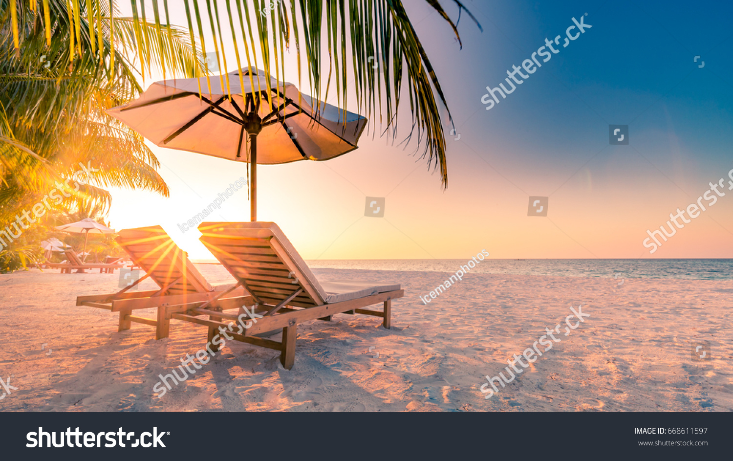 Summer holiday and vacation design. Inspirational tropical beach, palm trees and white sand. Tranquil scenery moody travel landscape #668611597
