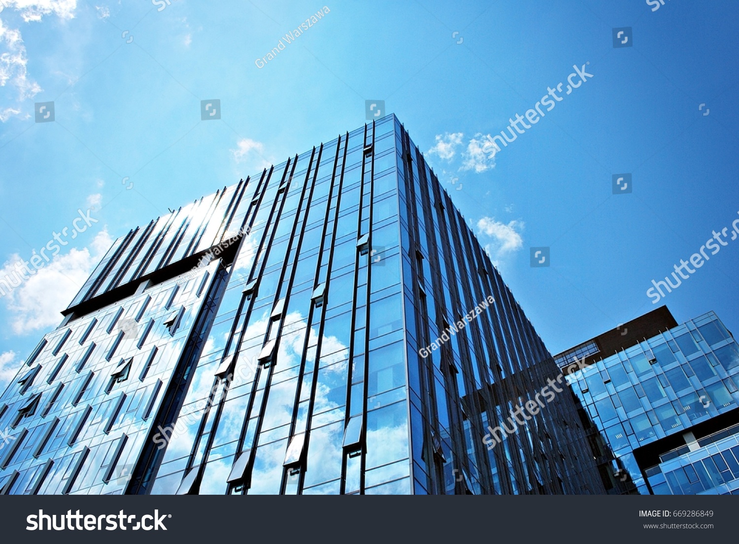 Modern building.Modern office building with facade of glass #669286849