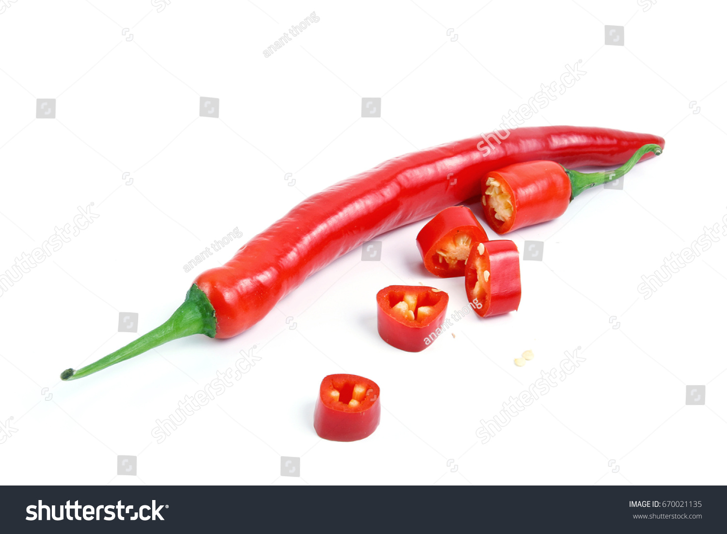 Red chilli or chili peppers cut into pieces isolated on a white background. #670021135